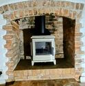 Exe Valley Stoves installation of an Invicta Sedan in Ivory